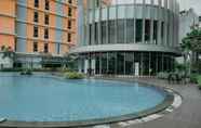 Swimming Pool 6 Comfort and Nice 2BR at Pejaten Park Apartment By Travelio