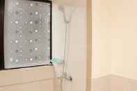 In-room Bathroom Cozy and Warm Living 3BR at Meikarta Apartment By Travelio