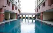 Swimming Pool 2 Cozy and Comfort 2BR at Gajah Mada Mediterania Apartment By Travelio