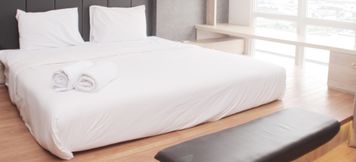 Bedroom 2 Cozy and Minimalist Studio at Vasanta Innopark Apartment By Travelio