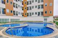 Swimming Pool Warm and Tranquil 2BR Apartment at Urban Heights Residences BSD City By Travelio