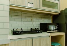 Common Space 3 Comfort Living and Minimalist 2BR at Signature Park Grande Apartment By Travelio