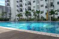 Swimming Pool Comfort Living and Minimalist 2BR at Signature Park Grande Apartment By Travelio