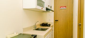 Common Space 4 Warm and Cozy Studio Room Apartment at B Residence By Travelio