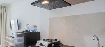 Common Space 2 Cozy and Simple Living Studio at Serpong Garden Apartment By Travelio