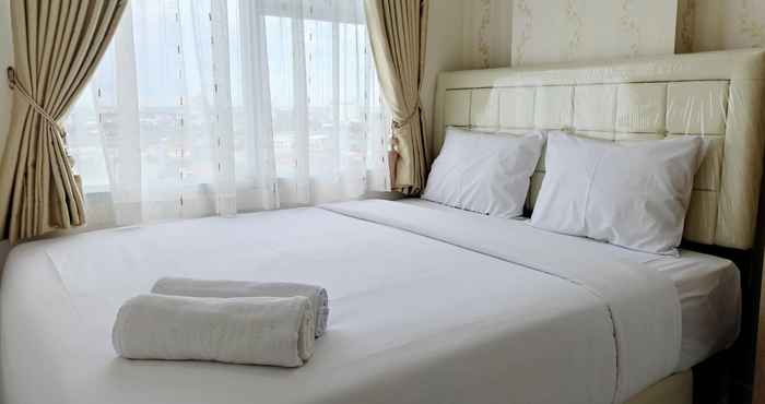 Kamar Tidur Clean and Simply 2BR Apartment at Vida View Makassar By Travelio