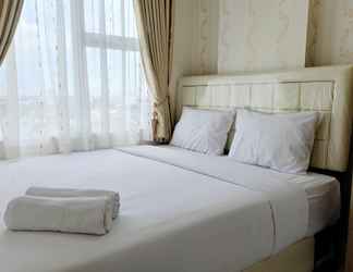 Bedroom 2 Clean and Simply 2BR Apartment at Vida View Makassar By Travelio