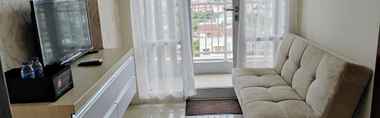 Lobby 2 Clean and Simply 2BR Apartment at Vida View Makassar By Travelio