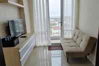 Lobi Clean and Simply 2BR Apartment at Vida View Makassar By Travelio