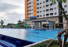 Swimming Pool 7 Modern Look 2BR Apartment Green Pramuka City near Mall By Travelio