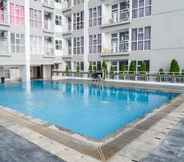 Swimming Pool 5 Stylish Living Studio at Apartment Taman Melati Surabaya By Travelio