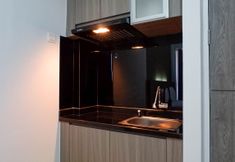 Common Space 3 Stylish Living Studio at Apartment Taman Melati Surabaya By Travelio