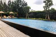 Swimming Pool Elegant and Nice 2BR Apartment Veranda Residence at Puri By Travelio