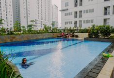 Swimming Pool 6 Restful and Comfort 2BR at Bassura City Apartment By Travelio