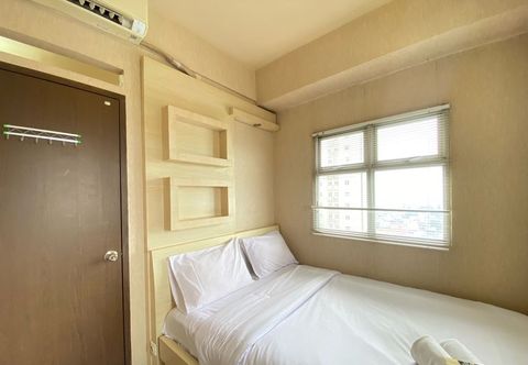 Bedroom Spacious and Cozy 2BR at Suites @Metro Apartment By Travelio