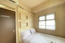 Bedroom Spacious and Cozy 2BR at Suites @Metro Apartment By Travelio
