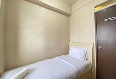 Bedroom 2 Spacious and Cozy 2BR at Suites @Metro Apartment By Travelio