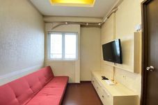 Common Space Spacious and Cozy 2BR at Suites @Metro Apartment By Travelio