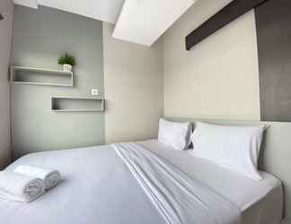 Bedroom 2 Furnished Cozy 2BR Apartment at Grand Asia Afrika By Travelio