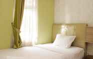 Bedroom 2 Homey and Warm 2BR at Springlake Summarecon Bekasi Apartment By Travelio