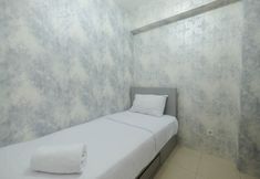 Bedroom 2 Restful and Strategic 2BR at Bassura City Apartment By Travelio