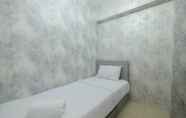 Bedroom 2 Restful and Strategic 2BR at Bassura City Apartment By Travelio