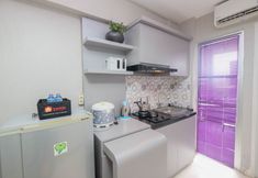 Bedroom 4 Restful and Strategic 2BR at Bassura City Apartment By Travelio