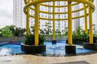 Swimming Pool Restful and Strategic 2BR at Bassura City Apartment By Travelio