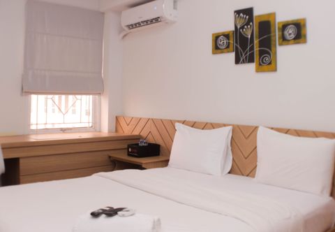 Bedroom Cozy Stay and Homey Studio Apartment at Patraland Urbano By Travelio