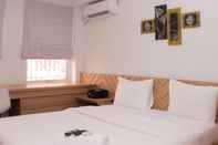 Bedroom Cozy Stay and Homey Studio Apartment at Patraland Urbano By Travelio