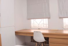 Bedroom 2 Cozy Stay and Homey Studio Apartment at Patraland Urbano By Travelio