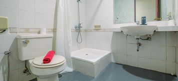 In-room Bathroom 5 Simply and Comfort Studio at Puri Kemayoran Apartment By Travelio