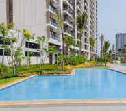 Swimming Pool 7 Tidy and Elegant 2BR at Sky House BSD Apartment By Travelio