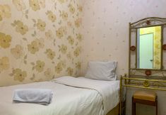 Bedroom 2 Comfort and Tidy 2BR Apartment at Green Pramuka City By Travelio