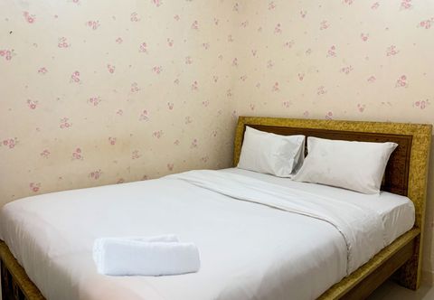 Bedroom Comfort and Tidy 2BR Apartment at Green Pramuka City By Travelio