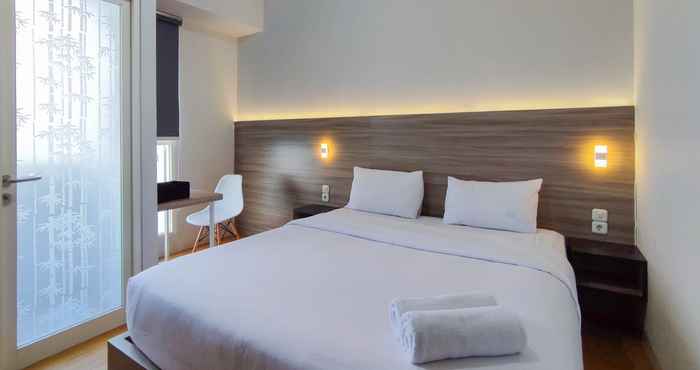 Bedroom Comfort and Warm 1BR at Amartha View Apartment By Travelio