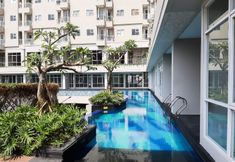 Swimming Pool 6 Comfy and Elegant Studio Apartment at Bintaro Icon By Travelio