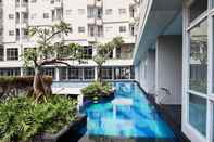 Swimming Pool Comfy and Elegant Studio Apartment at Bintaro Icon By Travelio