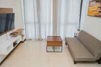 Common Space Comfy and Elegant 1BR at Marigold Nava Park Apartment By Travelio