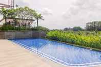 Swimming Pool Comfy and Elegant 1BR at Marigold Nava Park Apartment By Travelio