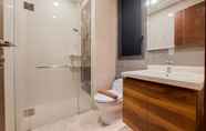 In-room Bathroom 5 Comfy and Elegant 1BR at Marigold Nava Park Apartment By Travelio