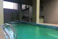 Kolam Renang Homey and Good Studio Furnished at Grand Asia Afrika Apartment By Travelio