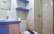 In-room Bathroom 6 Cozy and Comfort 2BR at Springlake Summarecon Bekasi Apartment By Travelio