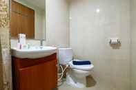 In-room Bathroom Well Equipped & Good Studio at The Oasis Apartment Cikarang By Travelio