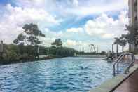 Swimming Pool Well Equipped & Good Studio at The Oasis Apartment Cikarang By Travelio