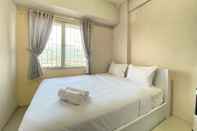 Bedroom Cozy 2BR at Pinewood Jatinangor Apartment By Travelio
