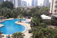 Swimming Pool Comfort 2BR Apartment Plus Extra Room at Sudirman Tower Condominium By Travelio