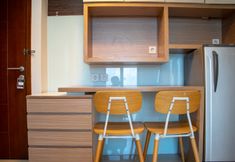Common Space 4 Homey and Nice 2BR Apartment at Capitol Park Residence By Travelio