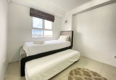 Bedroom 2 Exclusive 3BR Apartment at Gateway Pasteur By Travelio