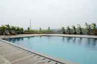 Swimming Pool Comfort 1BR Apartment at Tree Park City BSD By Travelio